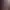 Vue d'un couloir menant à une pièce avec des vitraux colorés et des bougies allumées